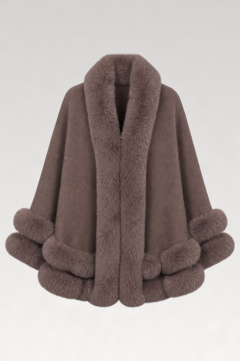 Cape en tricot bordée de fourrure